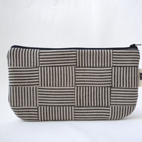 SCRAPPY CLUTCH IN STRIPED BASKETWEAVE