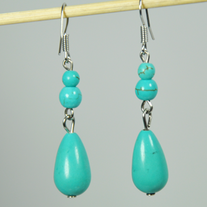 Slightly veined drop and sphere shaped turquoise color bead hook earring
