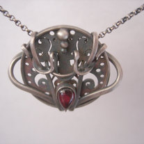 Garnet and silver circle necklace.