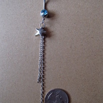 Shooting star belly navel ring.